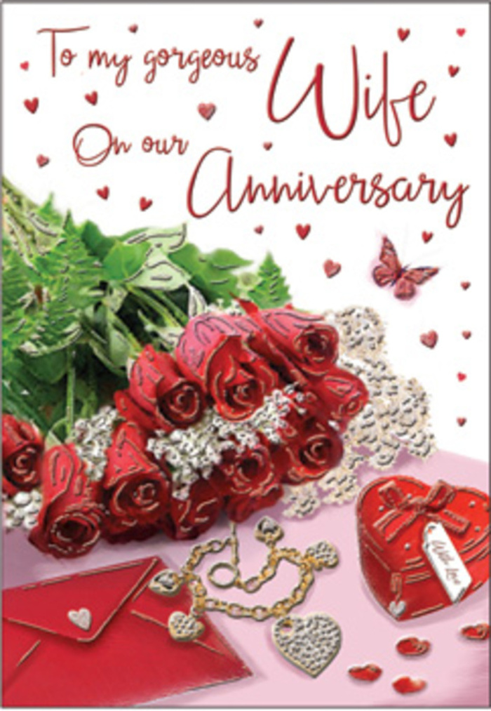 The image unfolds like a romantic vignette set in a quiet corner of Stepney, where every detail is chosen to honour an anniversary. At the centre, a dense cluster of classic red roses commands attention, each blossom luxuriously open, layered with silky petals that deepen from a rich ruby core to softer edges. They rest beside a folded envelope and greeting card, their white and cream tones creating a gentle contrast to the bold blooms, just as the calm streets around Stepney Green contrast with the busier rhythms of nearby Whitechapel Road. Interlaced with the roses is fresh greenery, crisp and bright, lending a natural softness that feels as though the bouquet has just been arranged by a careful local florist. Close at hand, a heart-shaped box-perhaps a jewellery or keepsake case-sits slightly ajar, its red exterior and smooth finish echoing the theme of love and treasured memories. A delicate piece of jewellery, possibly a necklace or pendant, lies nearby, its metallic highlights glinting in the soft light like small sparks of joy. Scattered around the composition are tiny heart-shaped accents and a single graceful butterfly motif, adding playful notes of magic and hope, as if symbolising the lightness that still lives in a long relationship. The lighting is gentle and flattering, casting soft shadows that define the curves of each rose and the folds of the card. The atmosphere suggests a private, heartfelt celebration-perhaps after a day spent wandering through local Stepney streets-captured in one thoughtful, beautifully balanced arrangement that speaks quietly of lasting affection.