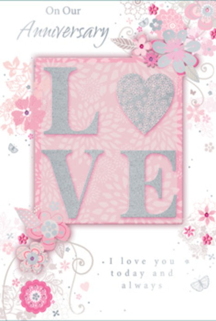 This close-up image presents an anniversary card that feels like a paper echo of a hand-arranged bouquet from a trusted Stepney florist. Dominating the centre is the word LOVE, rendered in tall, graceful letters you can almost feel with your fingertips. Each letter is slightly raised, coated in a frosted blush-pink glitter that catches the light with a gentle, pearly shimmer, edged here and there with silver that sparkles like tiny flecks of starlight over Stepney at dusk. The background behind the word is a soft, dreamy pink that gradually lightens as it radiates outward, evoking the soft bloom of a rose opening petal by petal. Flowing horizontally and vertically around this focal point, wispy, hand-drawn flowers and leaves, in tones of blush, ivory, and pale grey, drift like gentle sprays along a bouquet's edges. Their lines are fine and slightly sketch-like, with subtle shading and occasional silver-foil accents that add a hint of luxury. Among the florals, delicate curls, filigree-style vines, and a few almost-hidden butterfly shapes contribute a sense of movement and quiet joy, like petals fluttering near the paths of Stepney Green Park. The card's anniversary message, including the heartfelt sentiment I love you today and always, is printed in a graceful, understated script that doesn't shout but speaks with calm conviction. Overall, the card gives the impression of stepping into a softly lit room adorned with pastel flowers-an intimate, enduring celebration of love, perfectly suited to accompany a romantic bouquet delivered across Stepney and nearby Limehouse for a meaningful anniversary surprise.